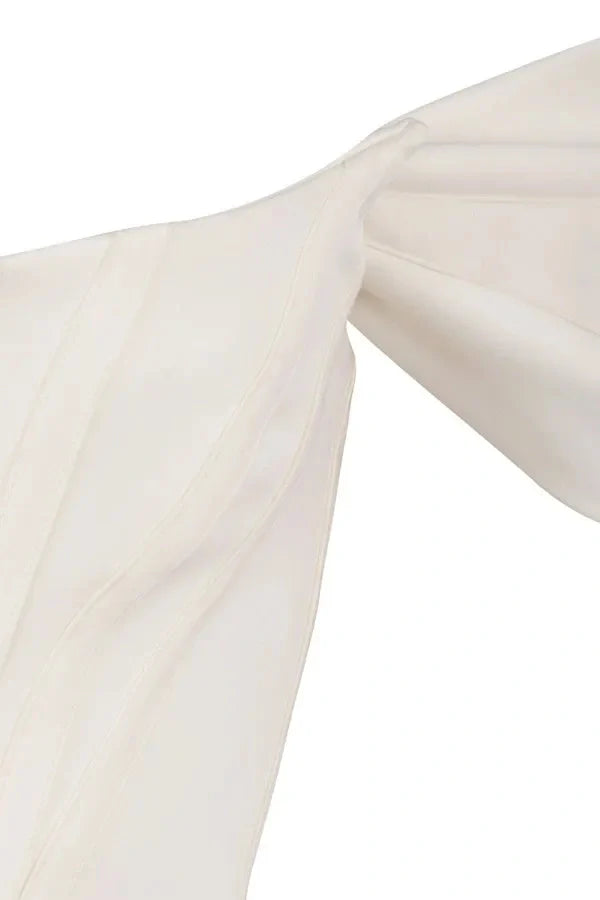 structured bodice, asymmetrical hemline, sweetheart neckline, sculpted silhouette, boning, and figure-flattering