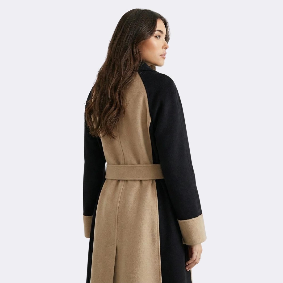Back view of the Kouvr Fashion Madison color-block wool coat, highlighting the black raglan sleeves and central camel panel with belt.