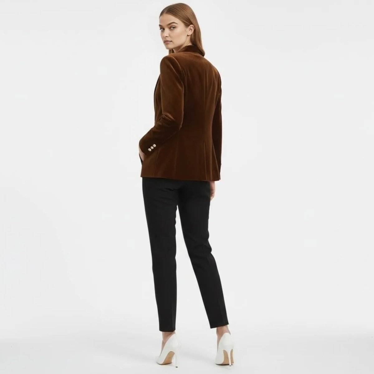 Back view of a model wearing the Kouvr Fashion Maribel brown velvet blazer, highlighting the structured shoulders and single back vent.