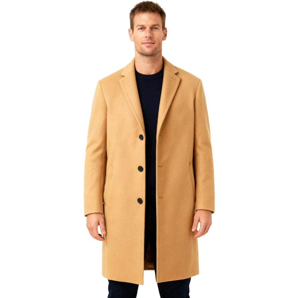 Man wearing a beige Kouvr overcoat on a white background