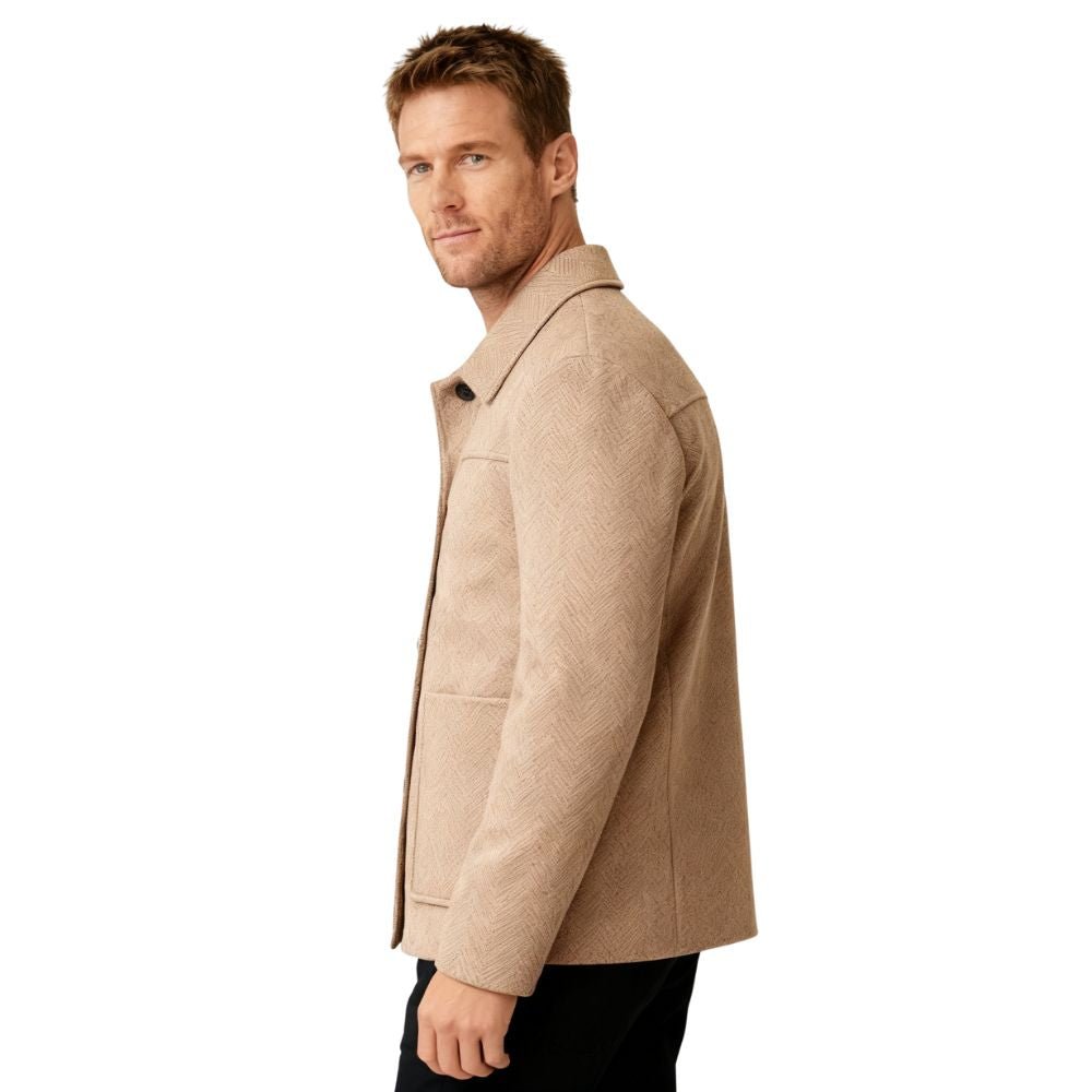 A man wearing the Kouvr Fashion khaki herringbone wool jacket over a white turtleneck, showcasing a smart casual look
