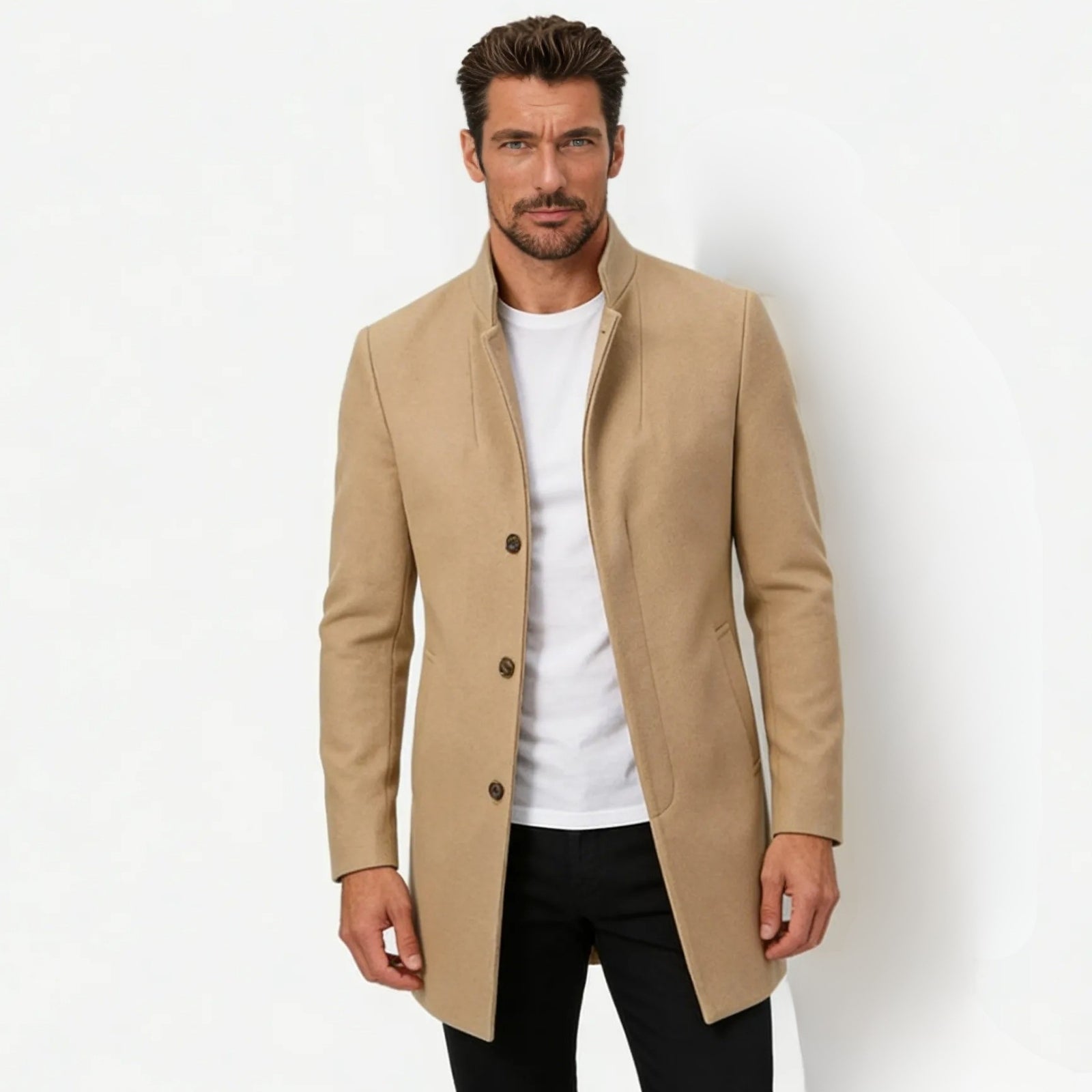 Model wearing the Kouvr Fashion men's slim fit khaki wool stand collar overcoat with a white t-shirt and black trousers against a white background. 