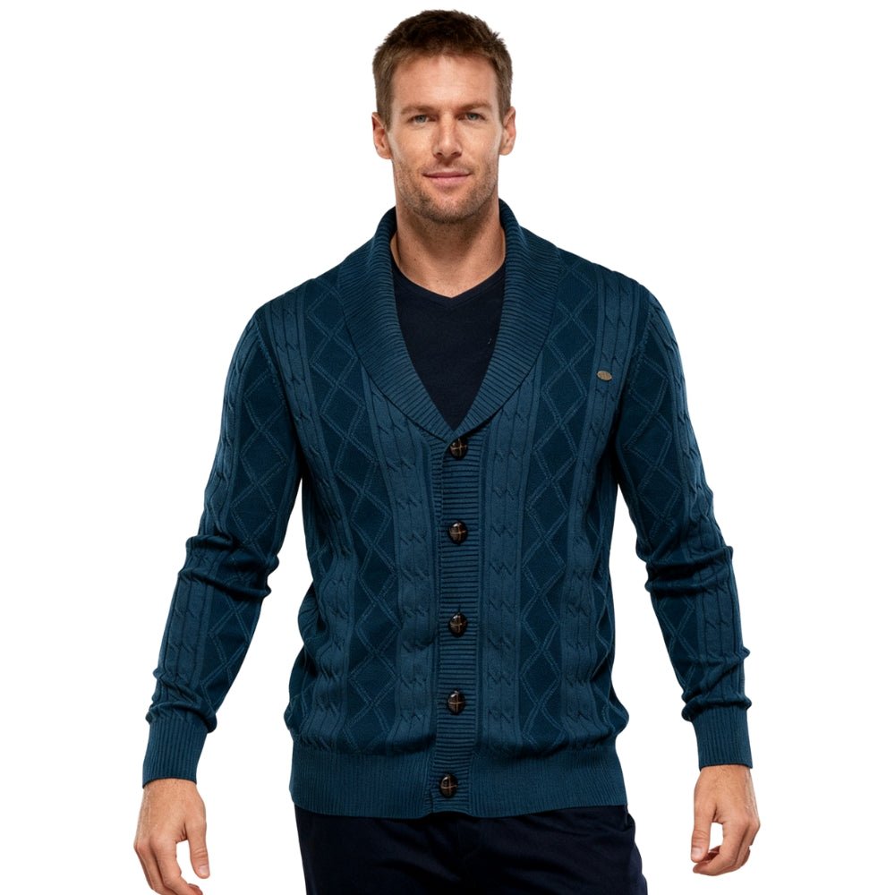 Man wearing a blue kouvr  patterned cardigan on a white background