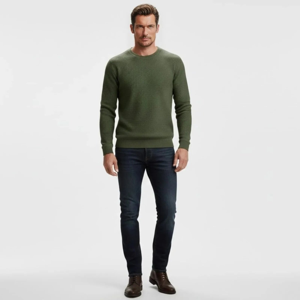 Male model wearing the Kouvr Fashion slim fit waffle knit crewneck sweater in olive green, front view.