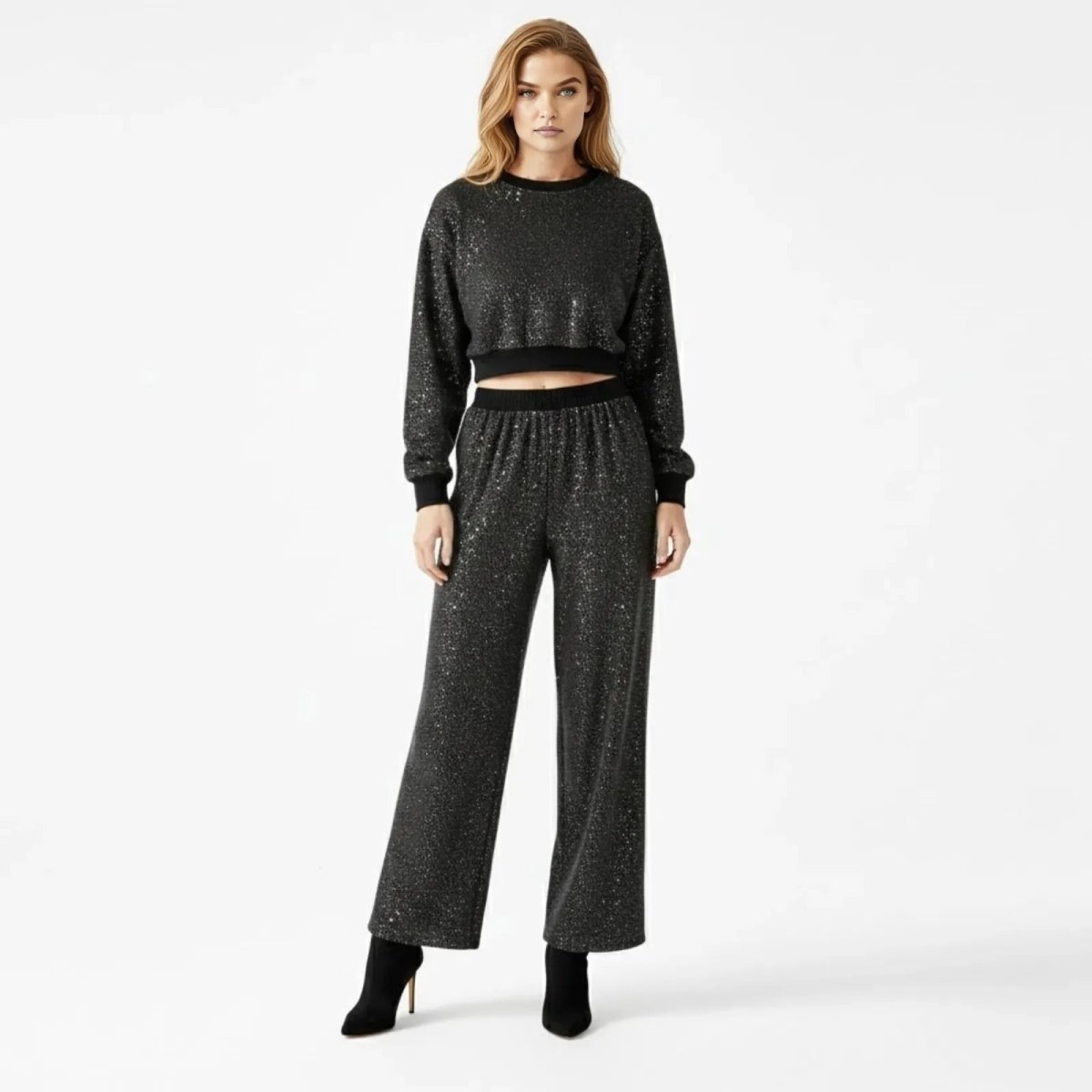 Model wearing the Kouvr Fashion Midnight Sparkle Co-ord Set in black, showing the cropped sweatshirt and wide-leg pants from the front.