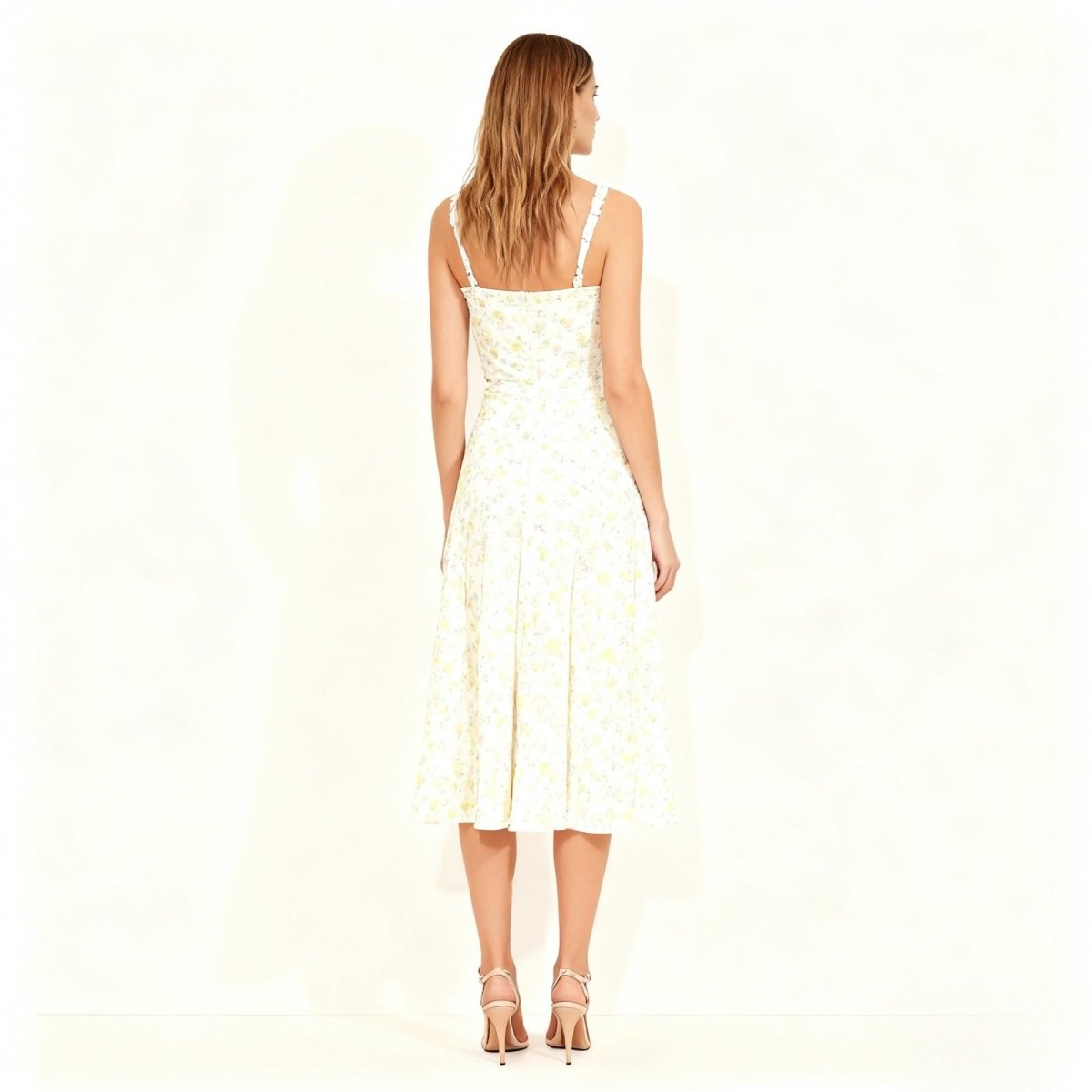 Back view of the Kouvr Fashion ivory dress highlighting the smocked back panel and delicate lace shoulder straps.