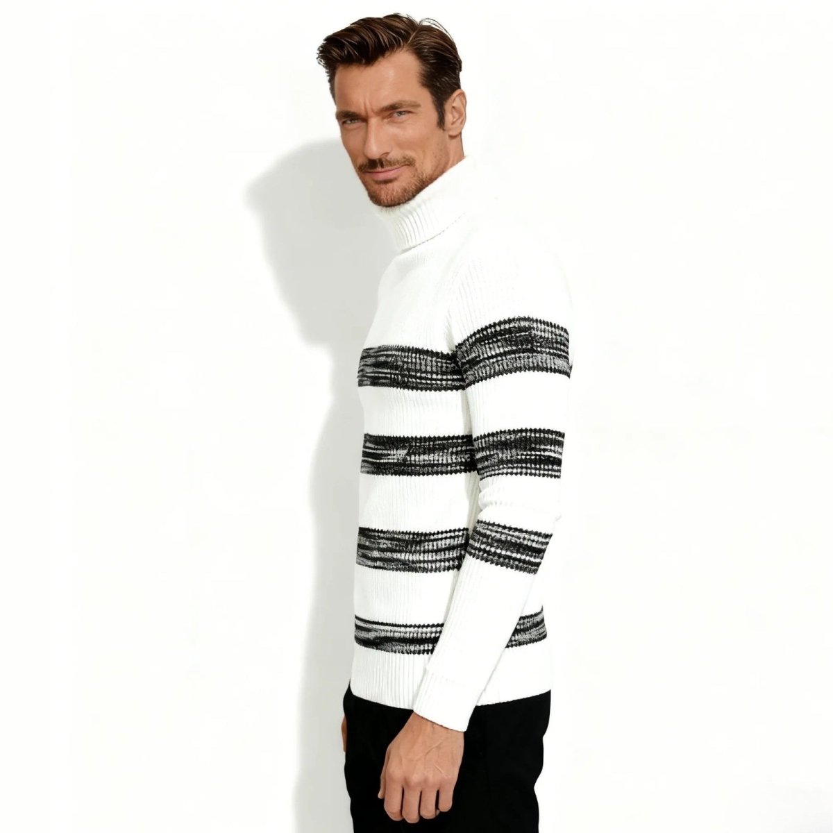 Side profile of a man wearing the Kouvr Fashion white and black striped roll neck sweater, showcasing its slim fit and ribbed knit texture.