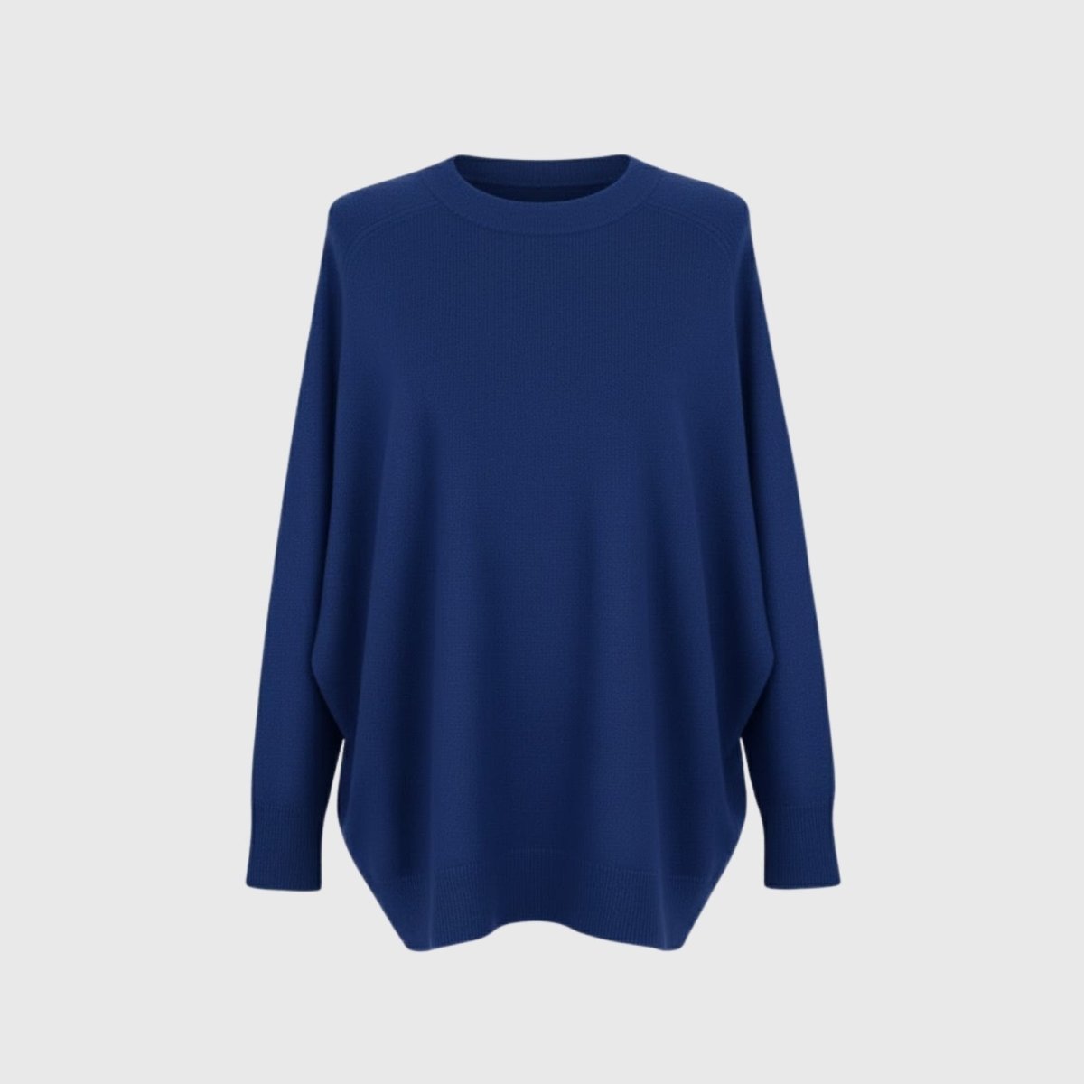 Product-only studio shot of the Kouvr Fashion oversized crewneck sweater in cobalt blue laid flat, showing texture and dolman sleeves.