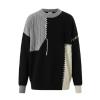 Product flatlay of the Kouvr Fashion men's sweater showing the full asymmetrical patchwork design with cable knit and chunky stitch details.