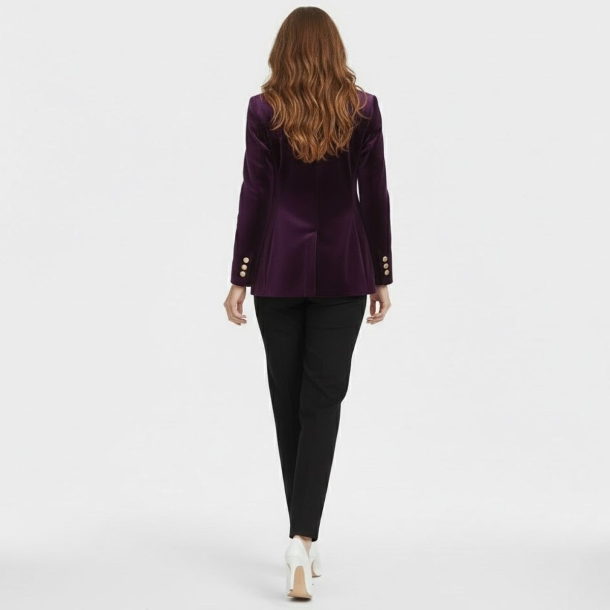 Back view of a model with long wavy brown hair wearing the Kouvr Fashion purple velvet blazer, highlighting the tailored construction.