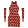Model wearing the Kouvr Fashion red crystal embellished sheer halter mini dress