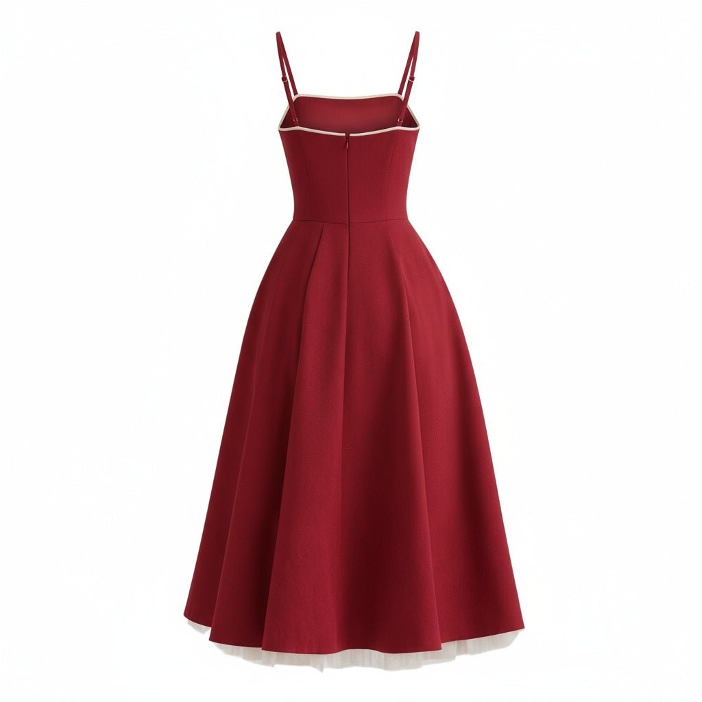 Back view of the Kouvr Fashion red formal dress with thin straps and structured bodice.