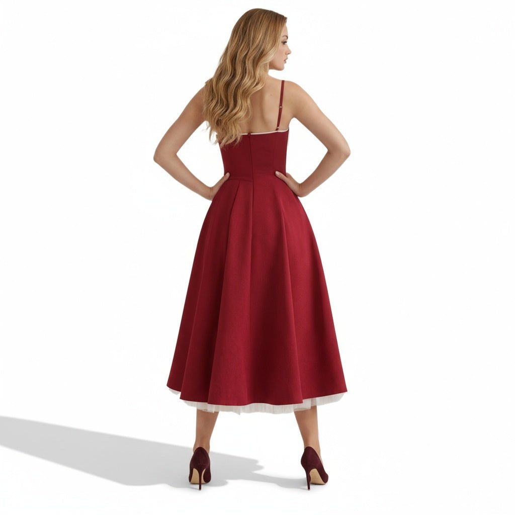 Back view of the Kouvr Fashion red formal dress with thin straps and structured bodice.