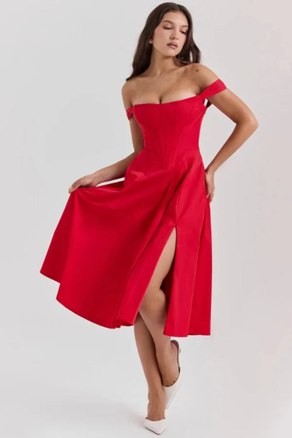 Bardot neckline, bustier dress, A-line skirt, thigh-high slit, lace-up back, wedding guest attire, structured bodice, statement dress