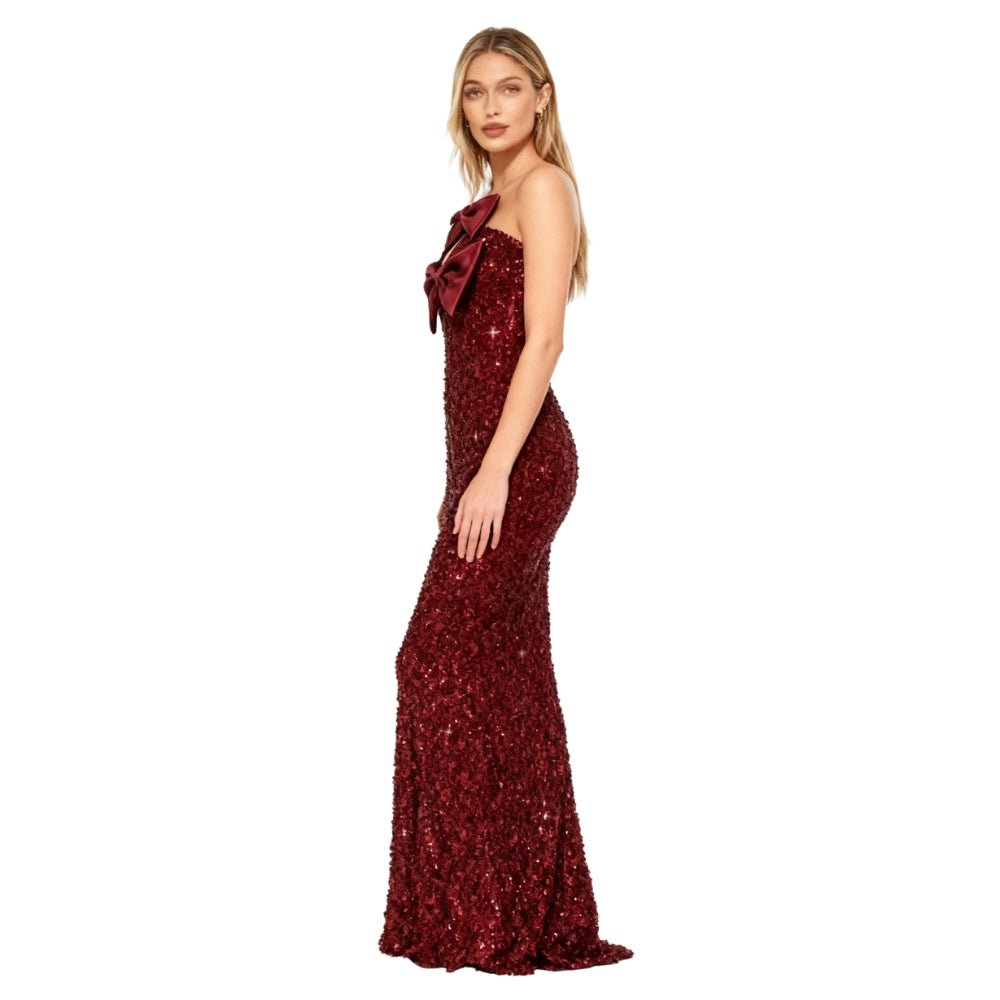 Red Kouvr sequin dress with a bow detail on a white background