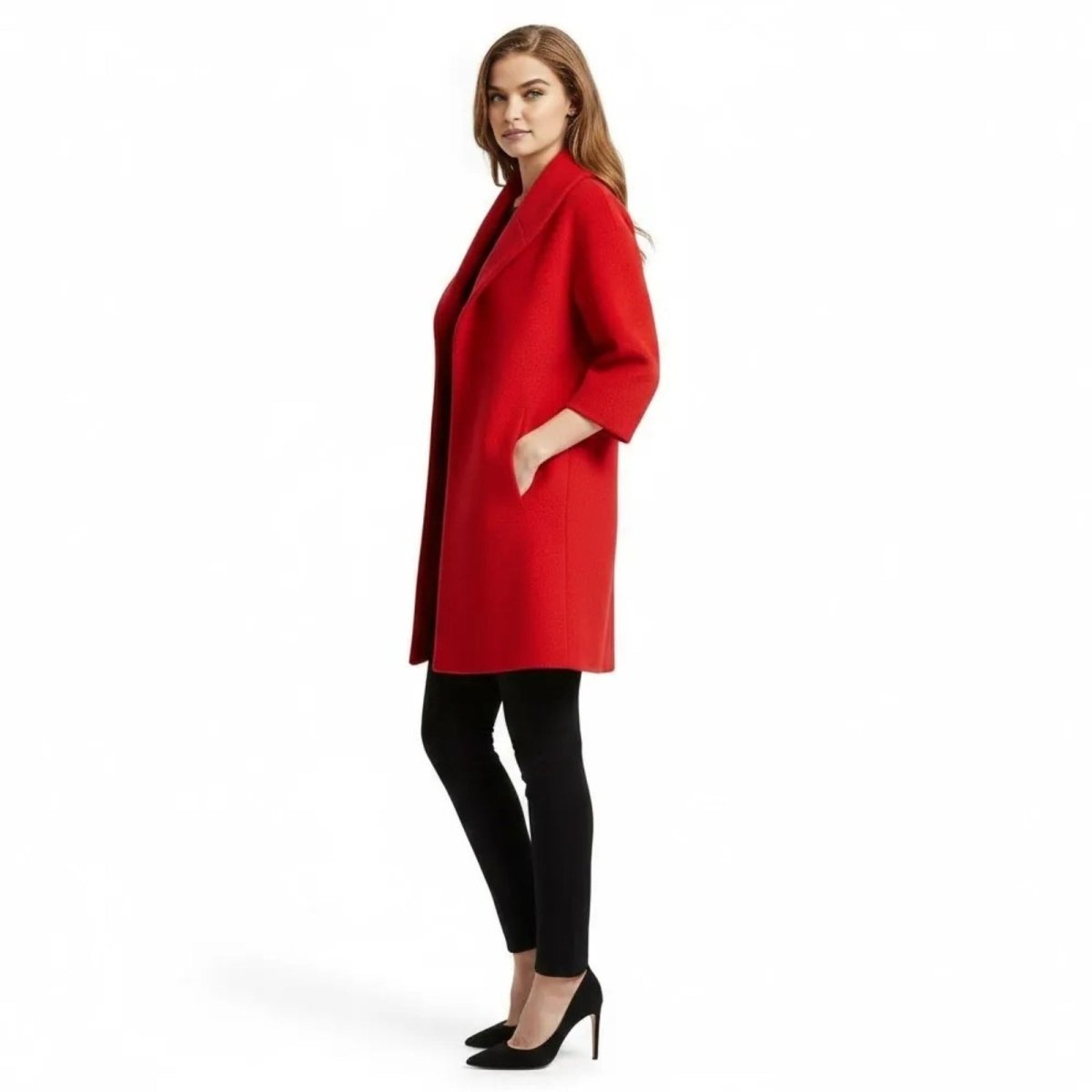 Side profile of a woman in a red open-front coat with her hand in the side seam pocket, showcasing the coat's silhouette.