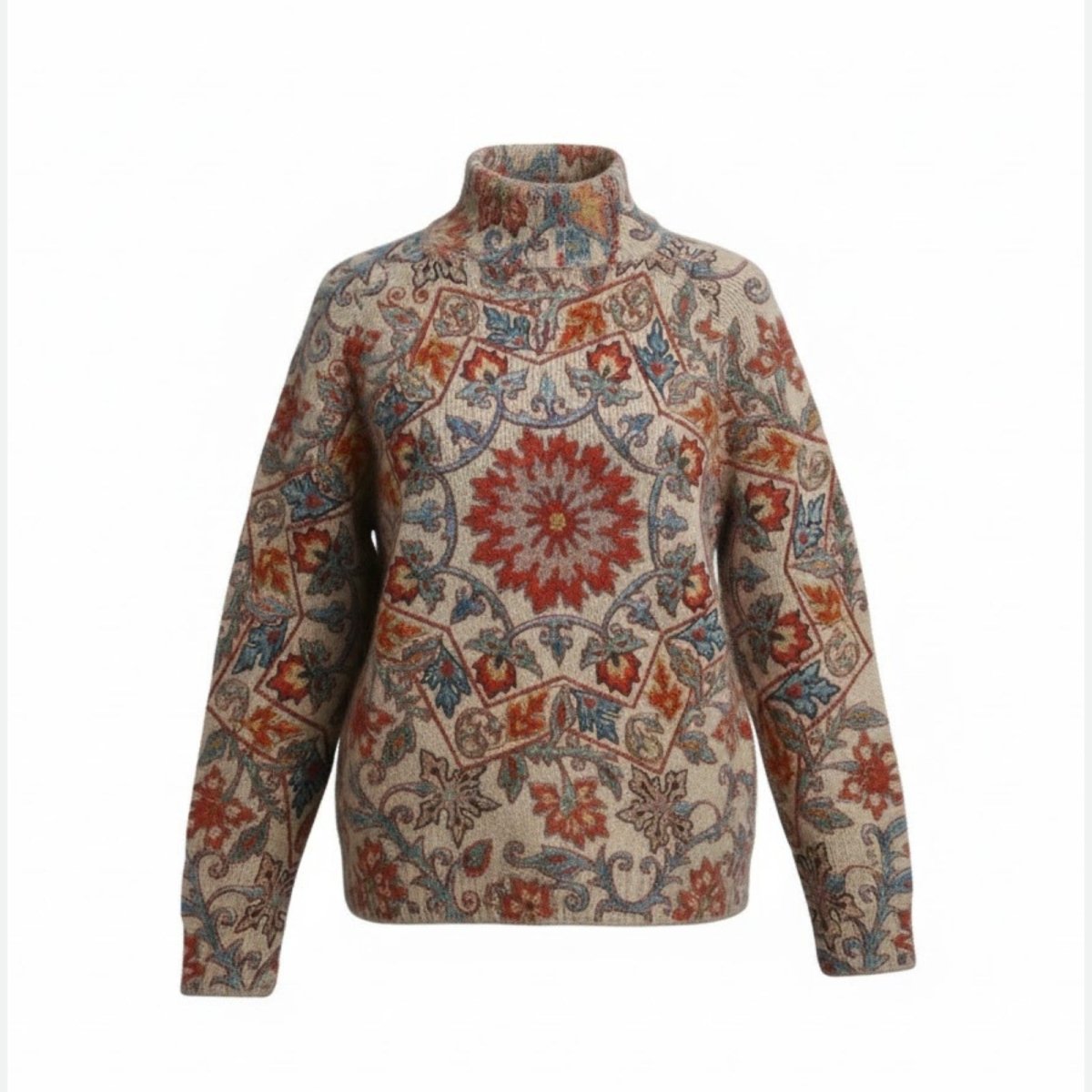 Front view of a luxury women's turtleneck sweater with a detailed jacquard regina pattern in burnt orange, red, and blue on a beige background.