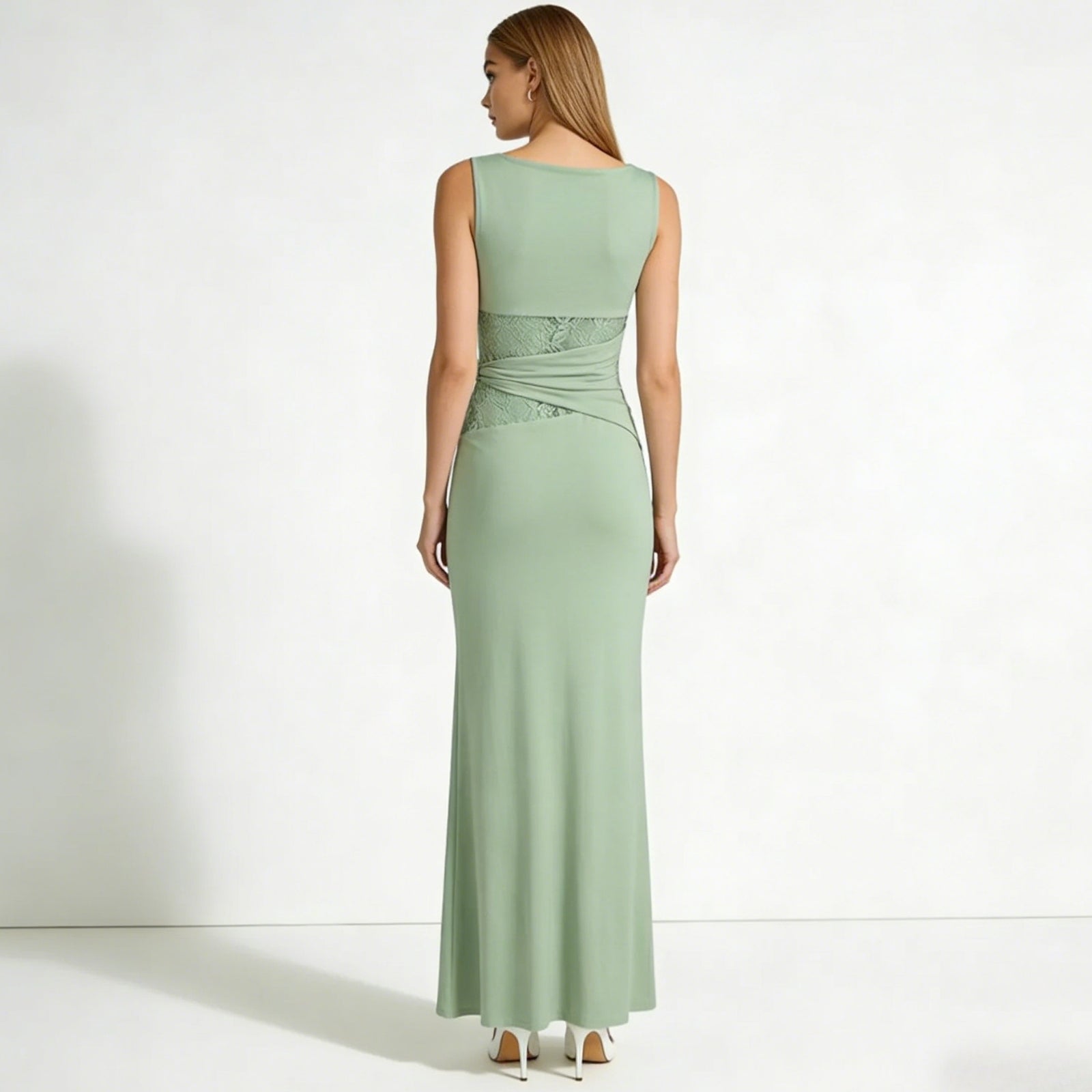 Back view of the Kouvr Fashion sage green formal dress, highlighting the boat neckline and lace wrap detail on the lower back.
