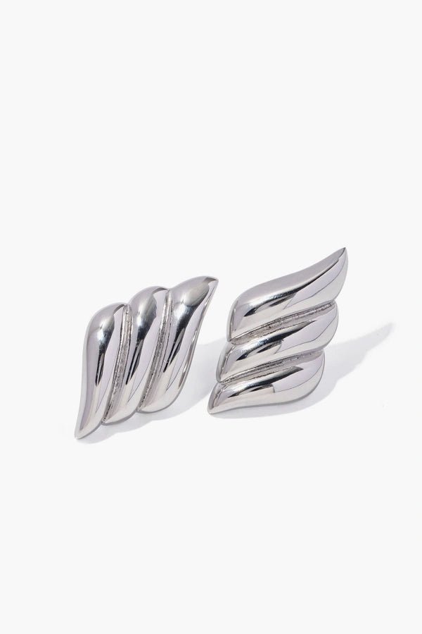 A pair of Kouvr Fashion silver sculptural earrings displayed against a clean white background.
