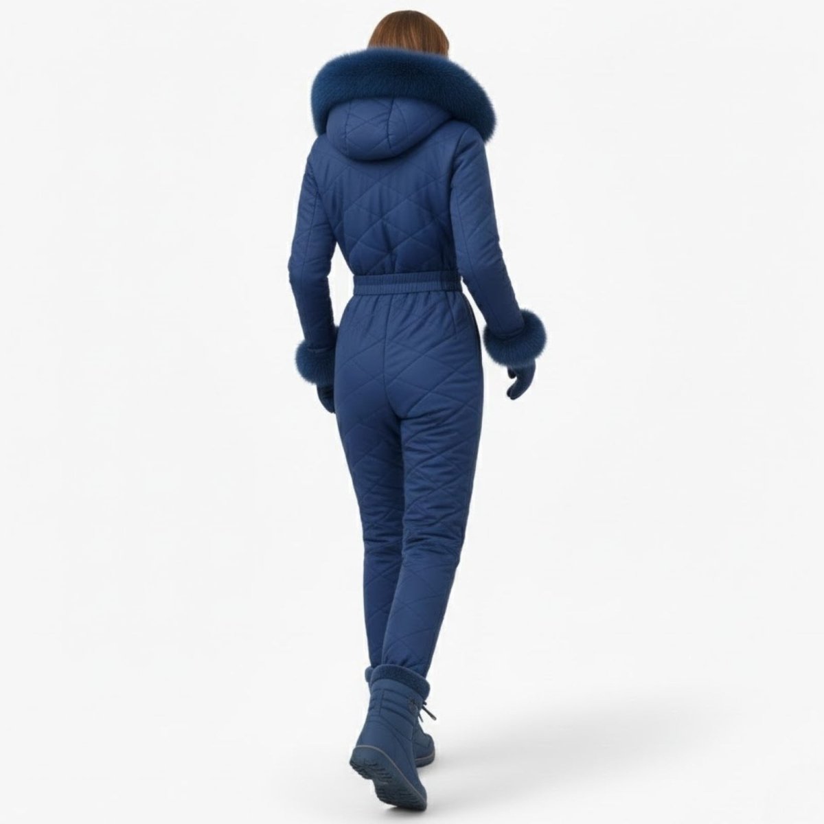 Back view of a model walking away in the blue Kouvr Fashion Skyla ski suit, highlighting the quilted pattern and fur-trimmed hood.