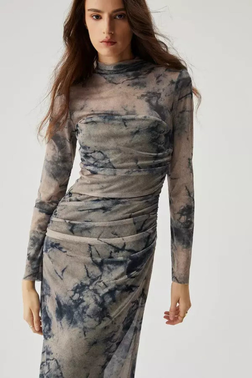 Model wearing the Kouvr Fashion long sleeve ruched mesh midi dress in a storm multicolor tie-dye print