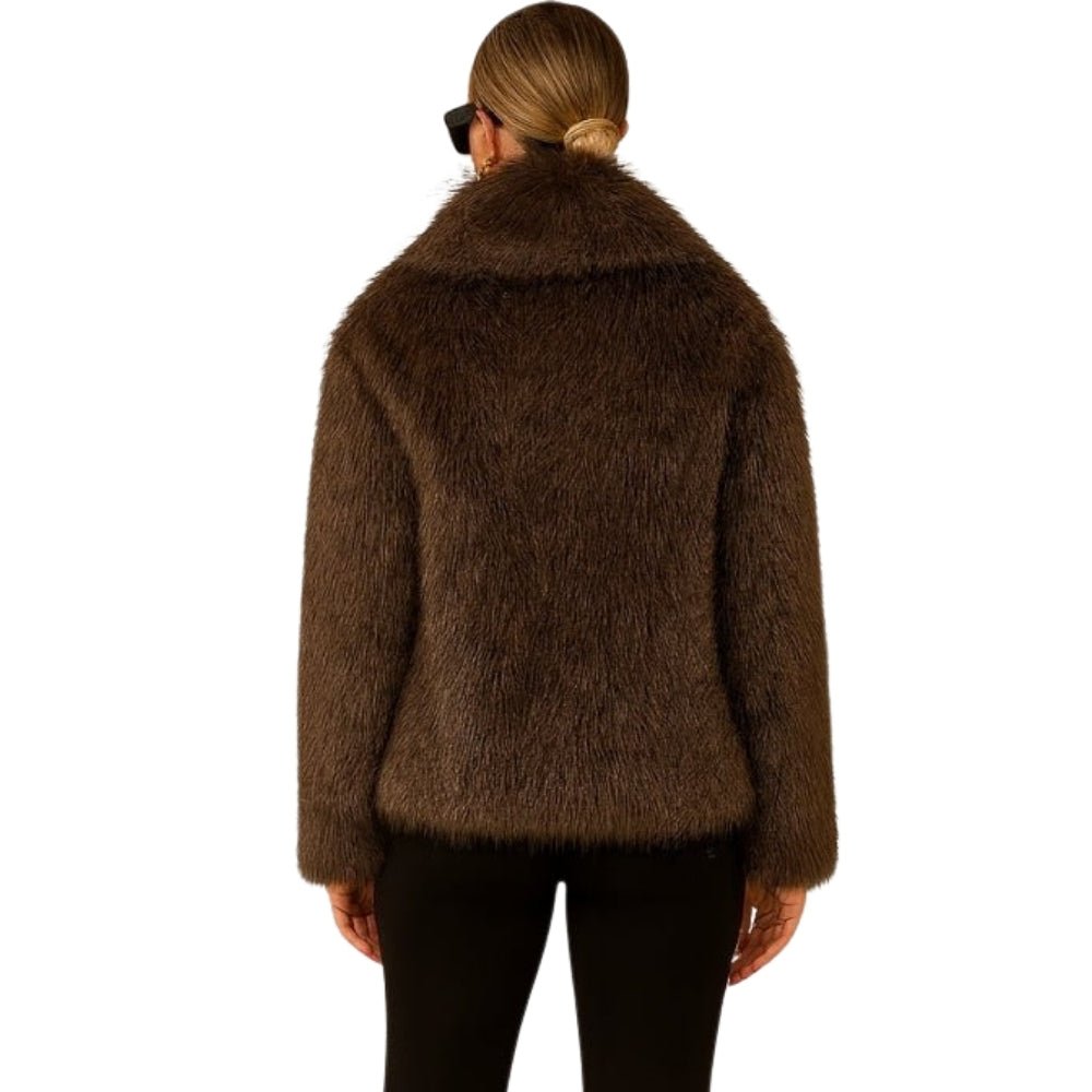 cruelty-free outerwear," "plush texture," "statement coat," "fall/winter essential," and "investment piece