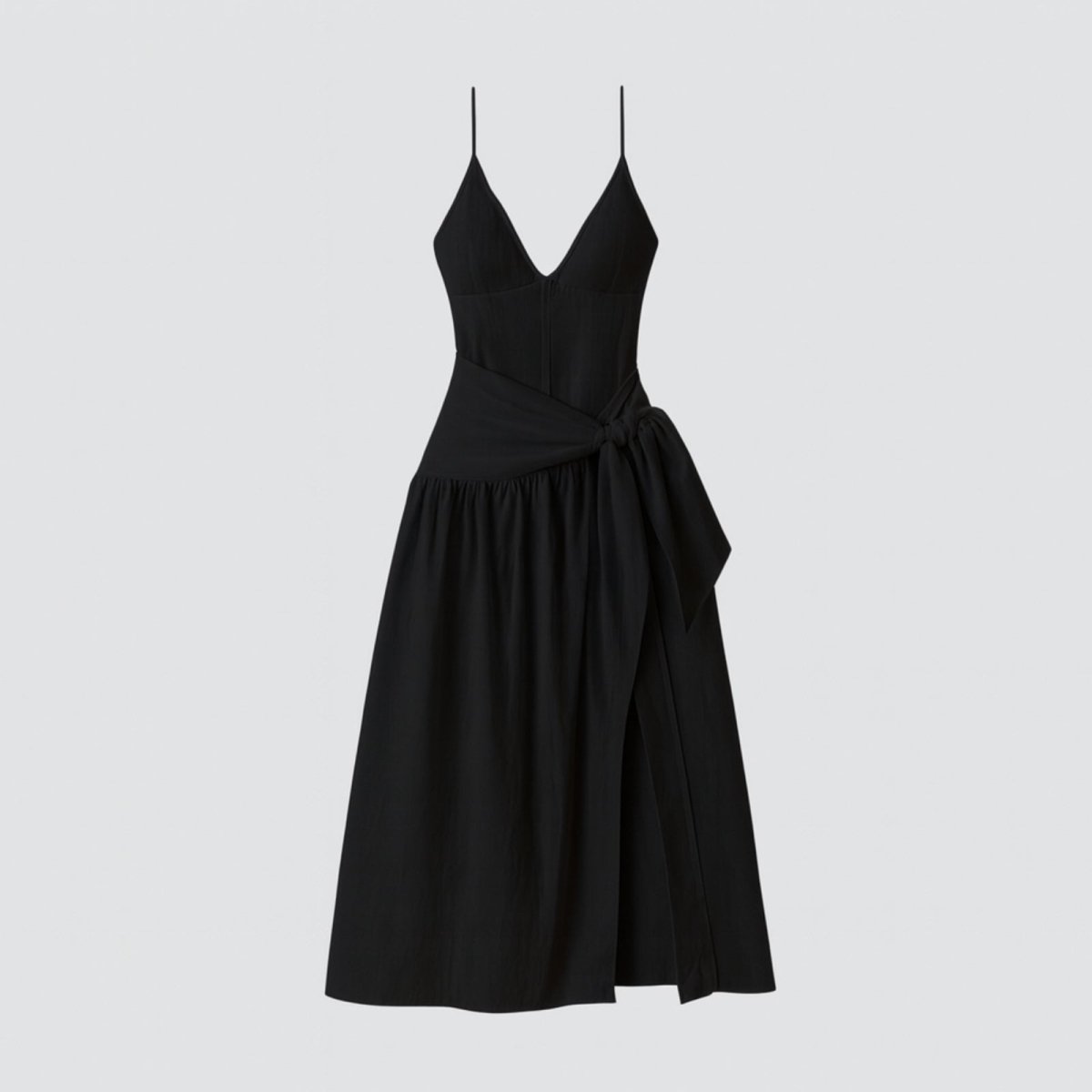 Black dress with thin straps on a light gray background