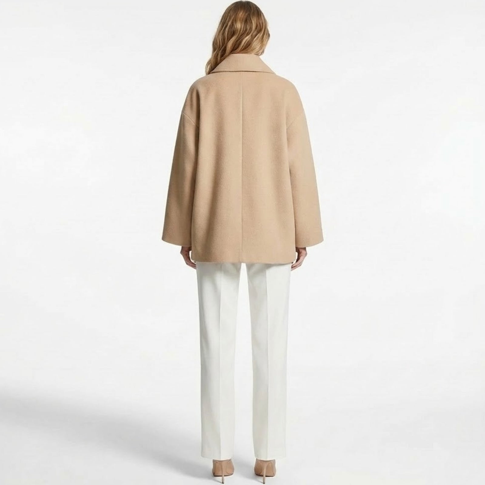 Back view of The Virginia khaki wool coat by Kouvr Fashion, displaying its clean, seamless construction and boxy, oversized fit for a modern look.