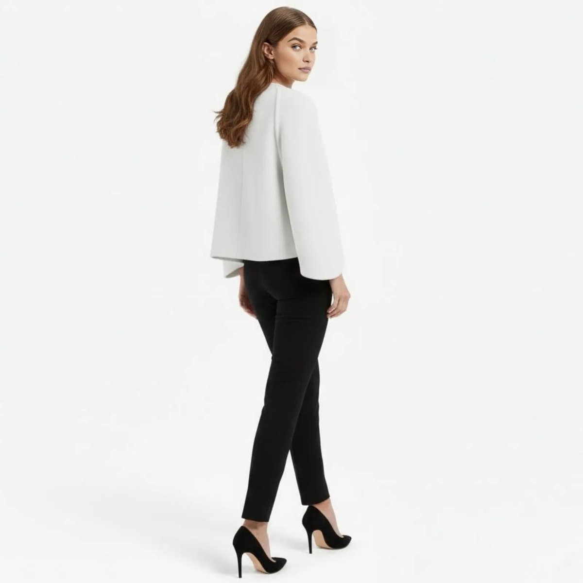 Back view of a model wearing the Kouvr Fashion minimalist white open-front jacket, highlighting the clean lines and structure.