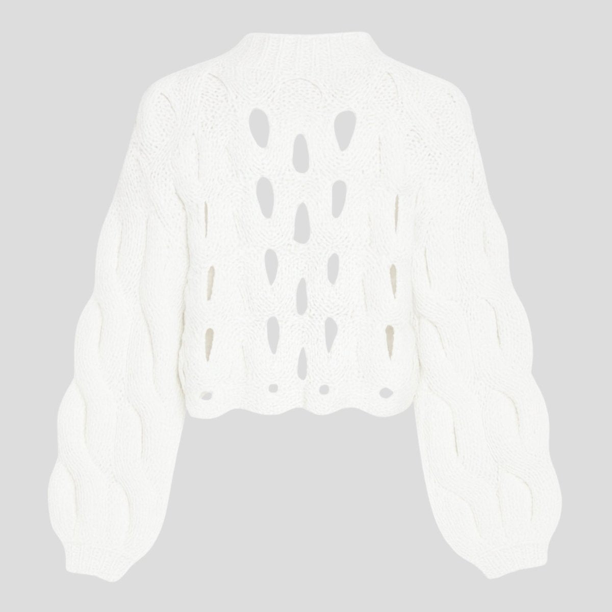 Flatlay product shot of the Kouvr Fashion white cutout chunky knit sweater, back side, on a light grey background.