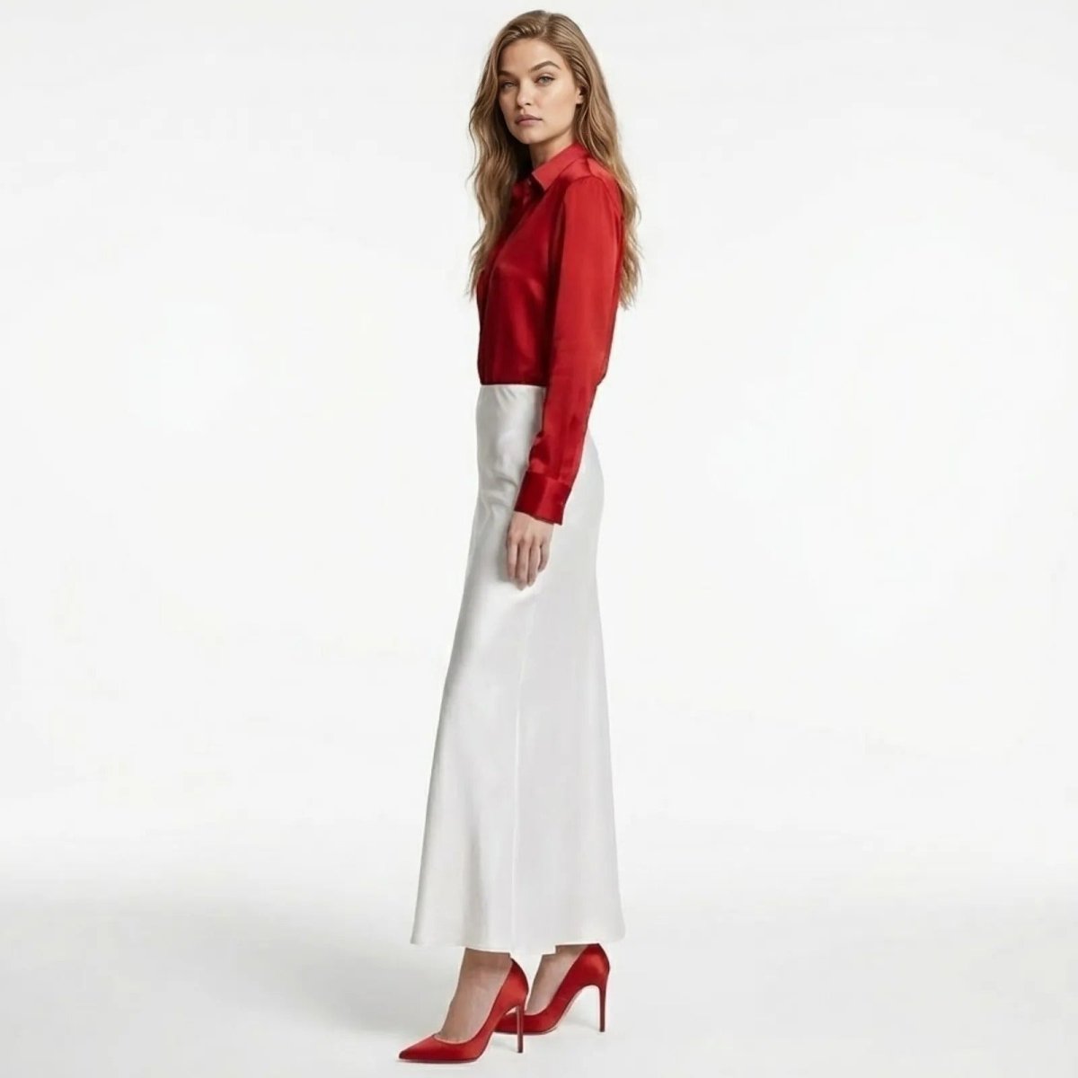 Side profile of the Kouvr Fashion long white satin skirt showing the bias cut silhouette and ankle-length hem.
