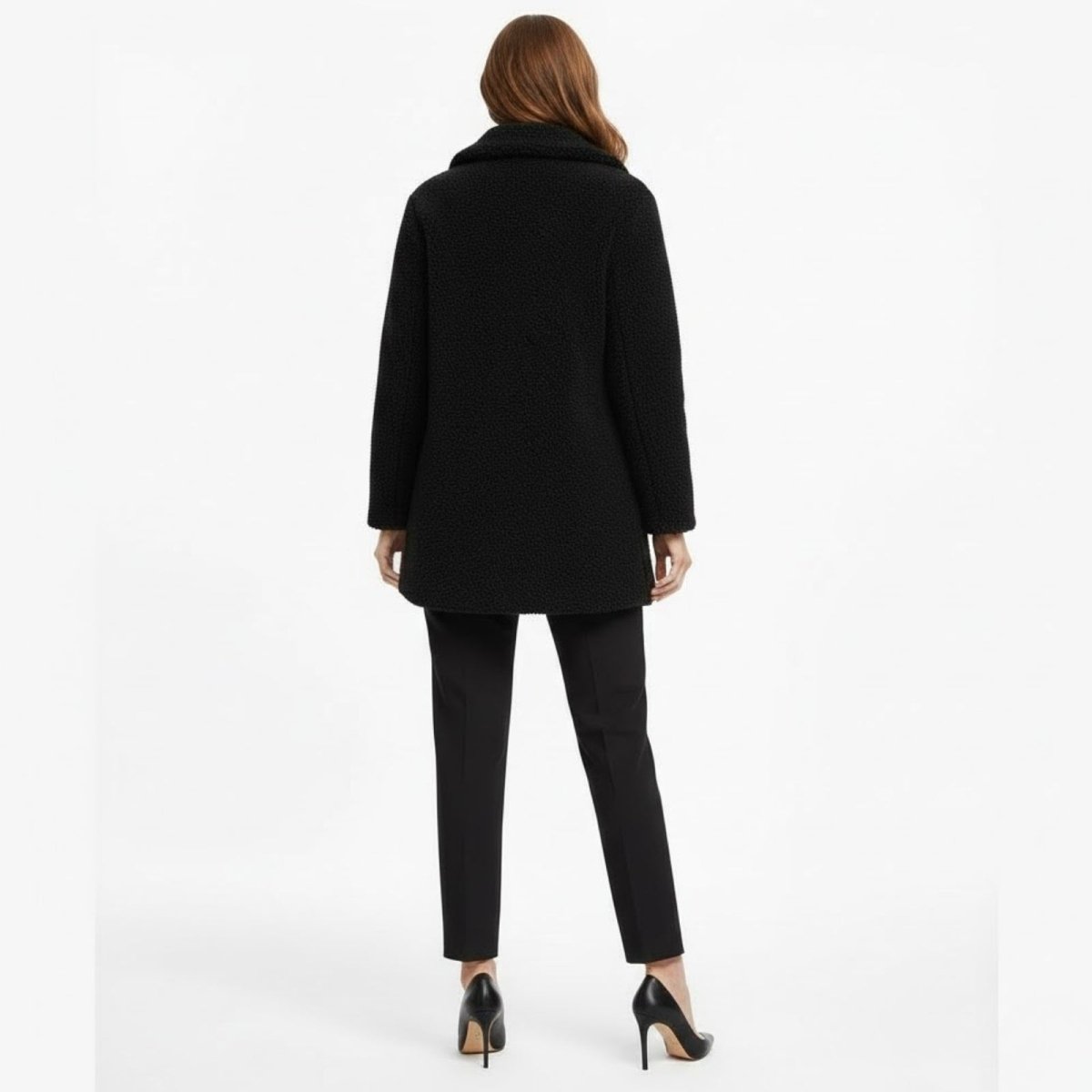Back view of the Kouvr Fashion black plush fleece overcoat, highlighting the tailoring and collar detail.
