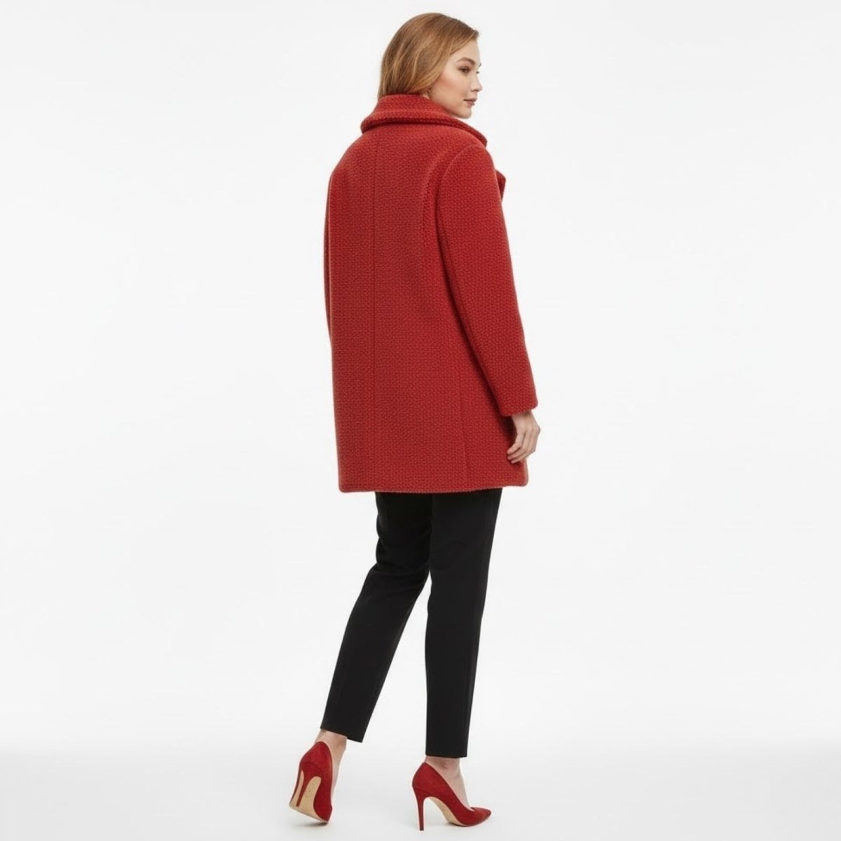 Back view of the Kouvr Fashion red teddy coat on a model, highlighting the textured material and clean tailoring of the outerwear piece.