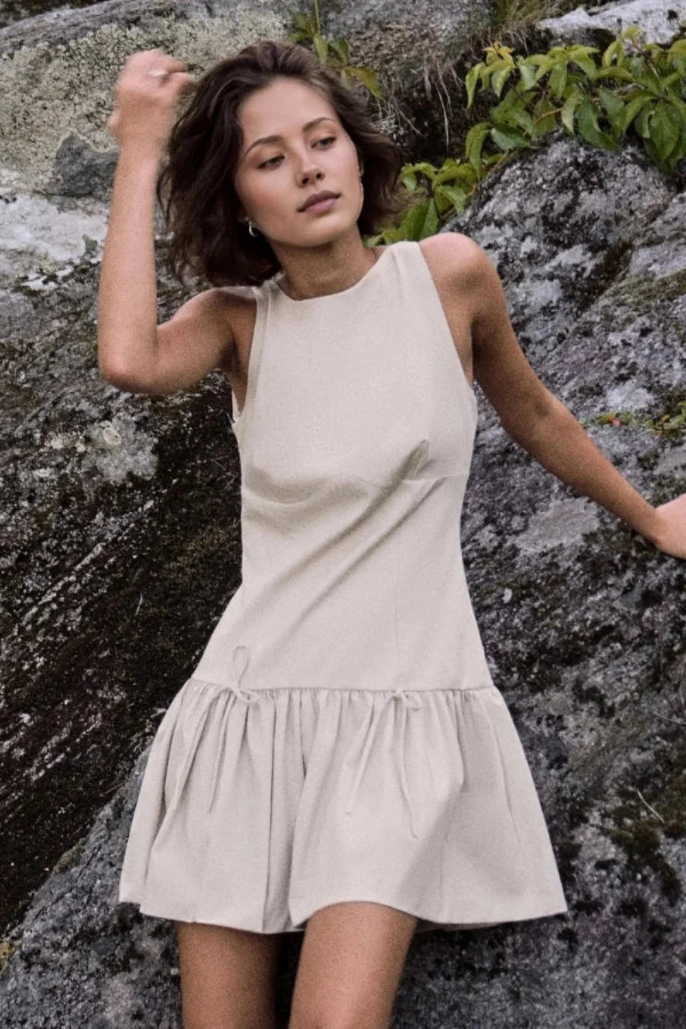 sculptural silhouette," "architectural design," "structured bodice," "boat neck," "minimalist aesthetic," "summer event wear," "vacation dress," "day-to-night outfit," "gathered skirt," "drawstring waist detail