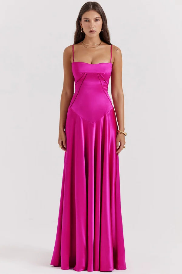 Model wearing the Kouvr Gabriella Gown in Fuchsia Satin with a lace-up corset back.