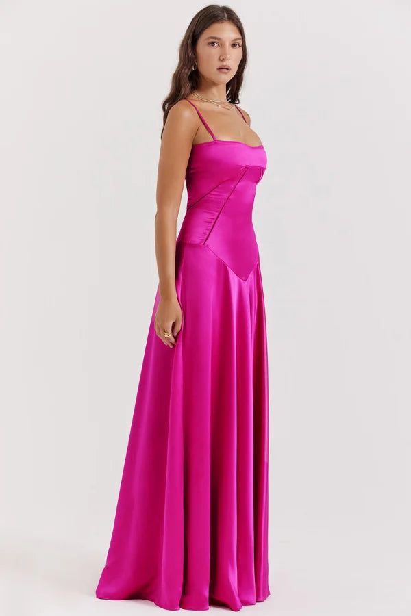 Model wearing the Kouvr Gabriella Gown in Fuchsia Satin with a lace-up corset back.