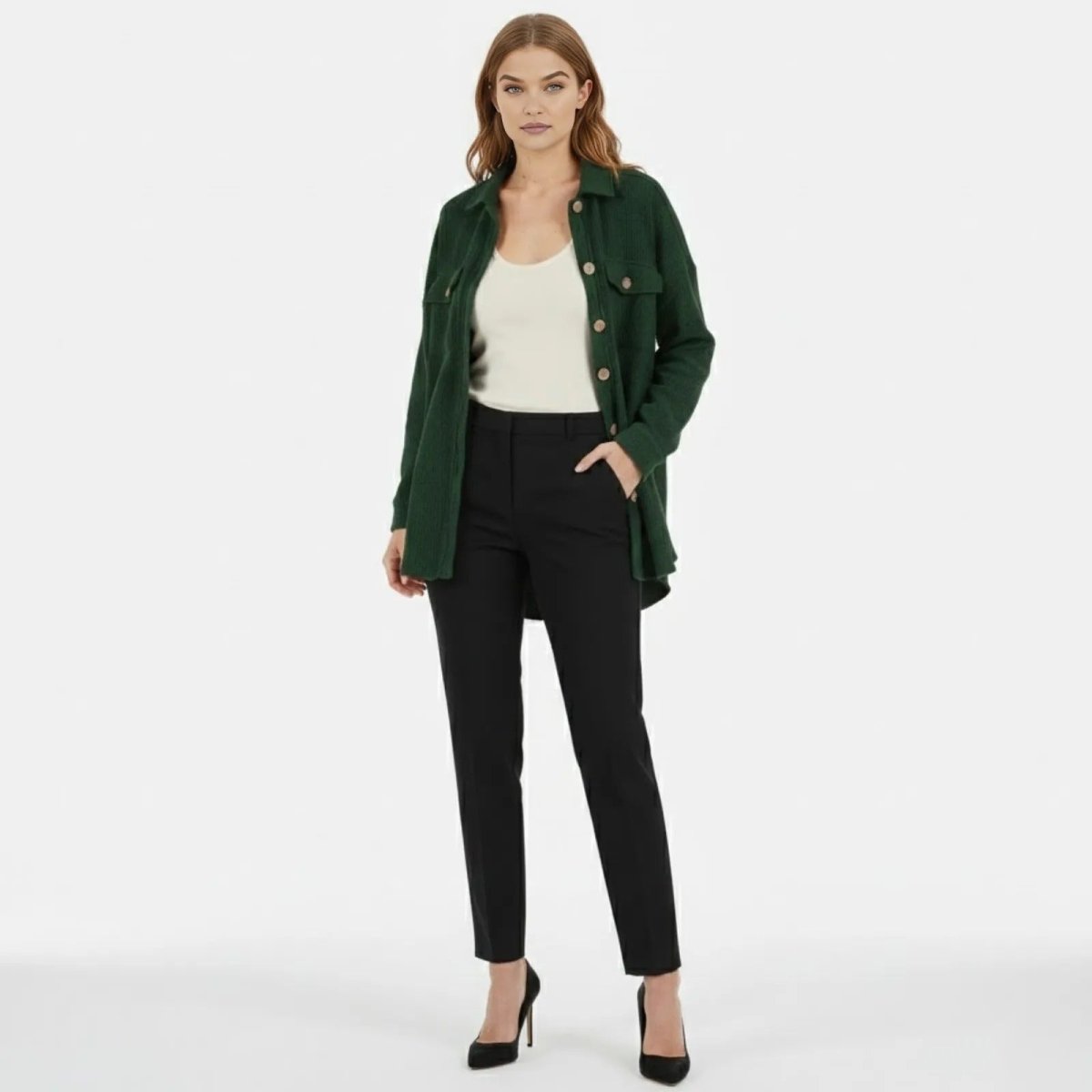 A female model wears the Kouvr Fashion oversized green waffle knit shacket, styled open over a white top and black trousers.