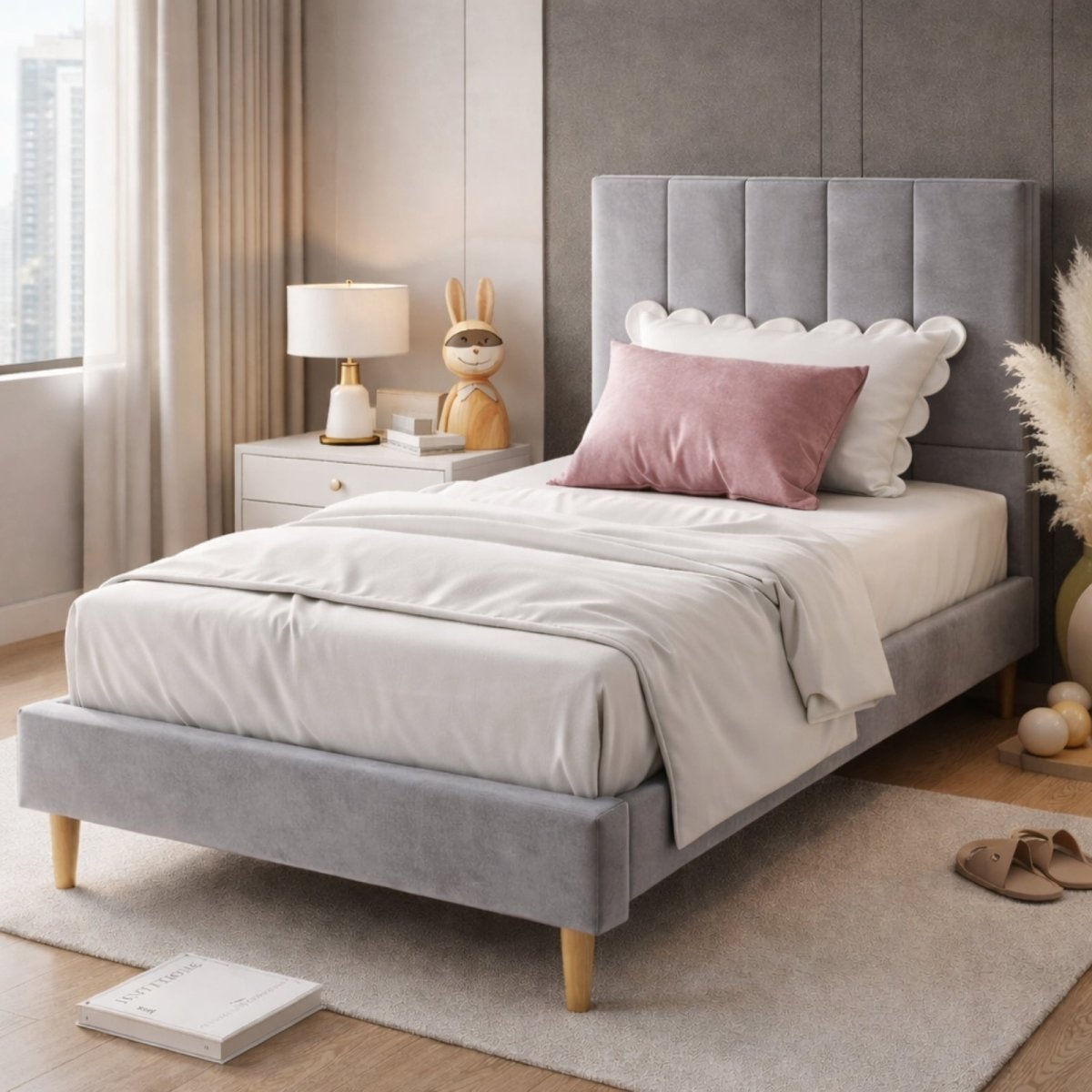  Kouvr grey velvet upholstered bed frame with vertical stitching on headboard, styled with contemporary decor and plush pillows.