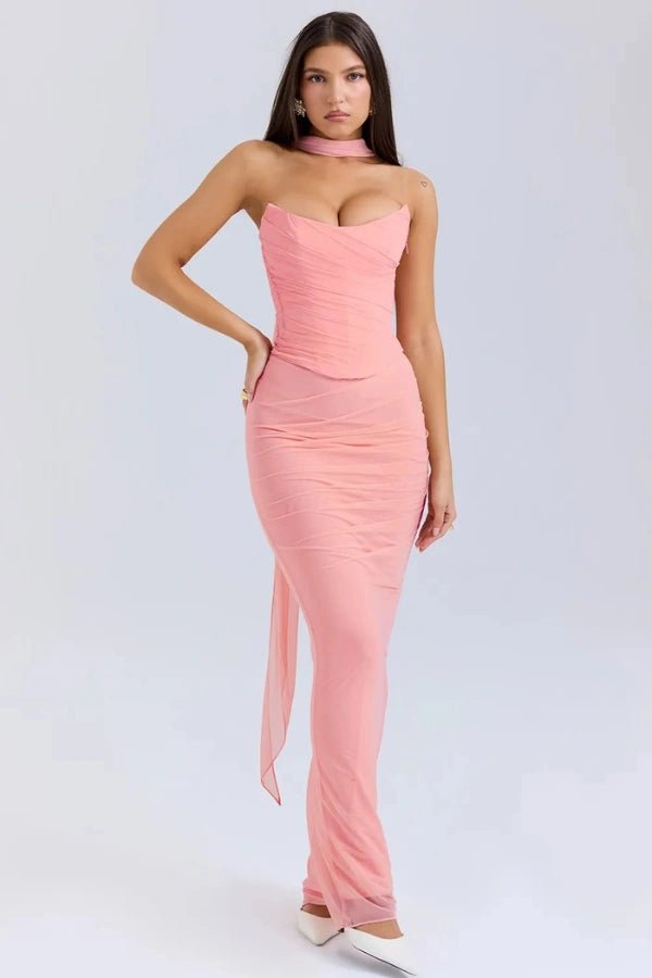 Model wearing the Hailey pink ruched mesh maxi dress with matching detachable choker by Kouvr, front view.