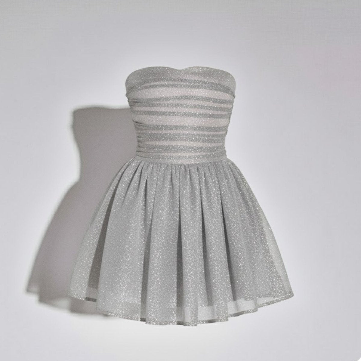 Front product shot of the Kouvr Harmonistrapless silver glitter mini dress on a ghost mannequin.
