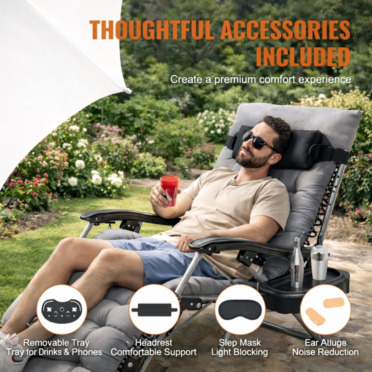 Man relaxing outdoors in a gray Kouvr patio lounge chair, highlighting the included headrest, side tray with drinks, and other comfort accessories.