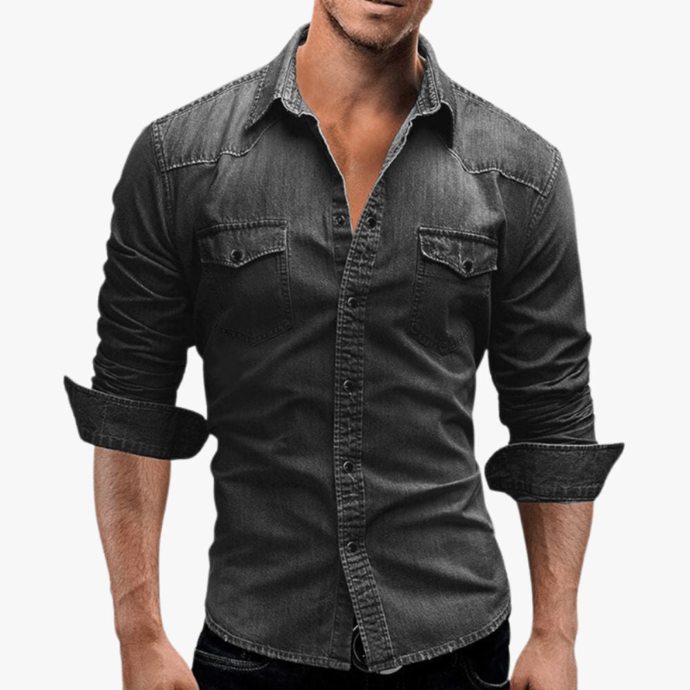 Man wearing the Kouvr Jackson slim fit black denim shirt with rolled sleeves