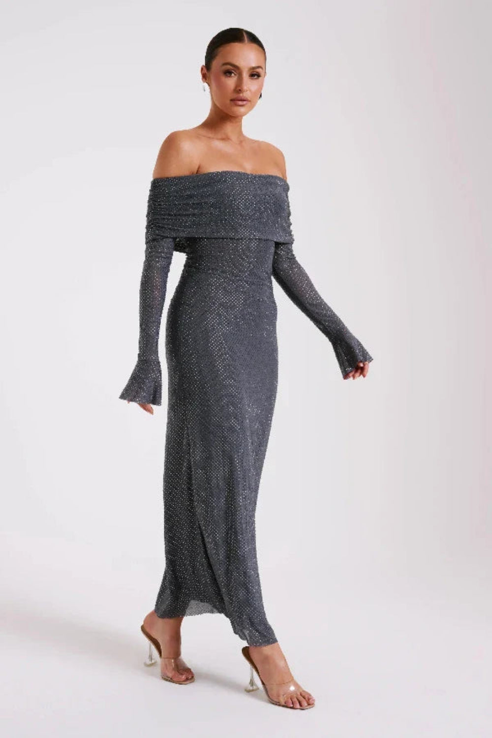Model wearing Kouvr Jada long sleeve off-the-shoulder evening gown in gray