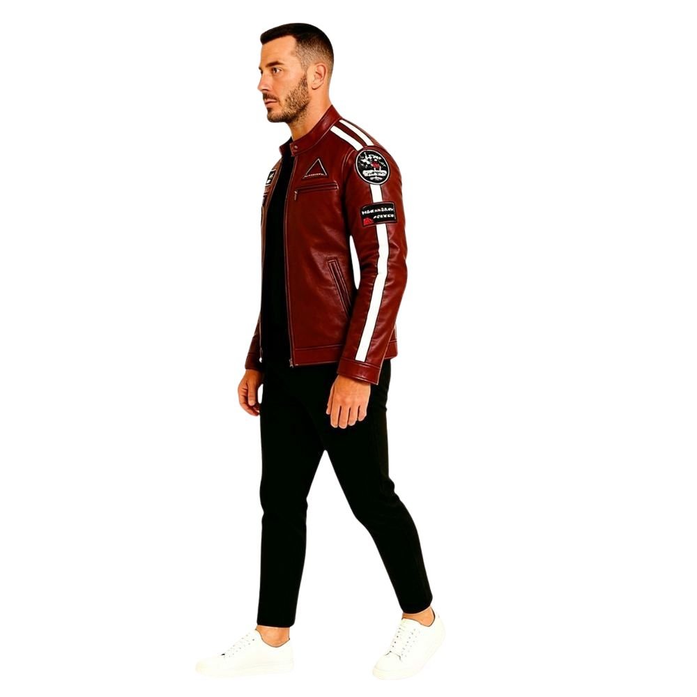 Man wearing a red kouvr leather jacket with patches on a white background