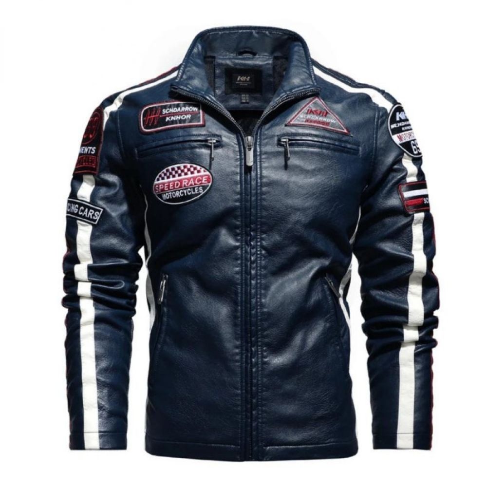 Man wearing the Kouvr Jayce Men's Navy Blue Leather Racer Jacket with embroidered patches and white stripes.