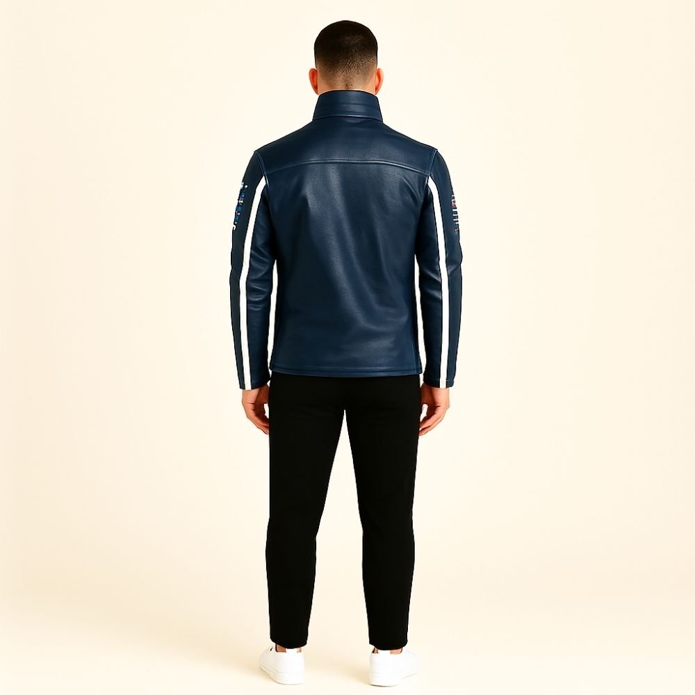 Man wearing the Kouvr Jayce Men's Navy Blue Leather Racer Jacket with embroidered patches and white stripes.