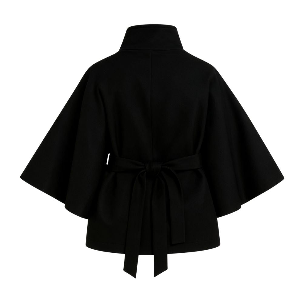 Model wearing Kouvr Fashion belted cape jacket with funnel neck and wide kimono sleeves