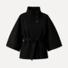 Model from behind wearing the black Kouvr Jaye Cape Jacket, showcasing the tie-back belt and wide kimono sleeves