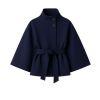 Model facing forward wears the Kouvr Jaye white wool belted cape coat with a high funnel neck and wide kimono sleeves