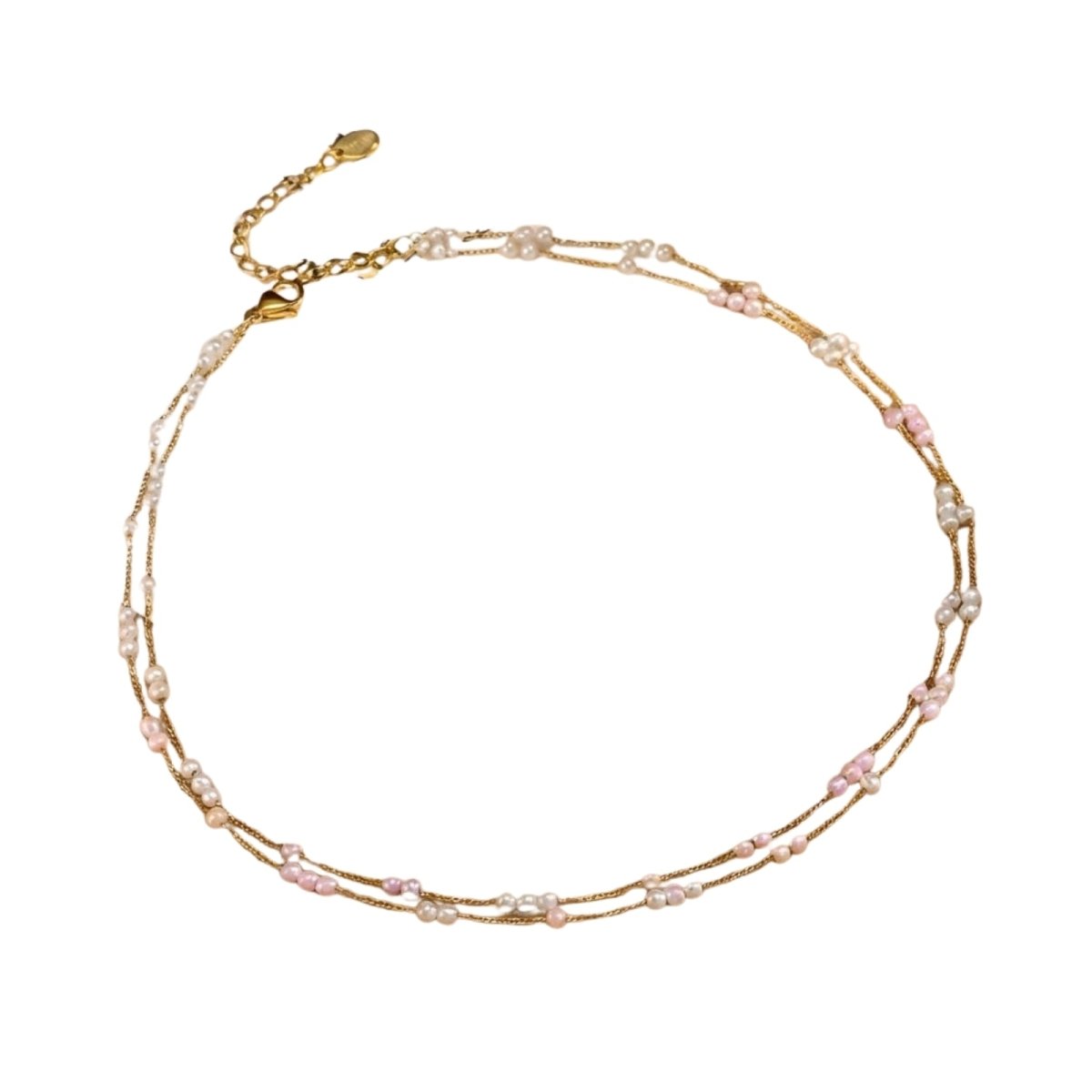 Kouvr Josie double strand necklace with pink and white freshwater pearls on a 14k gold plated chain, shown on a white background.